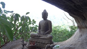 Buddha at the entrance to the cave