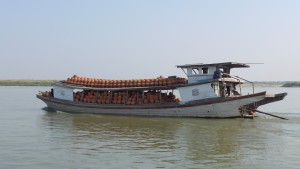 Transporting clay pots along the Irrawaddy River